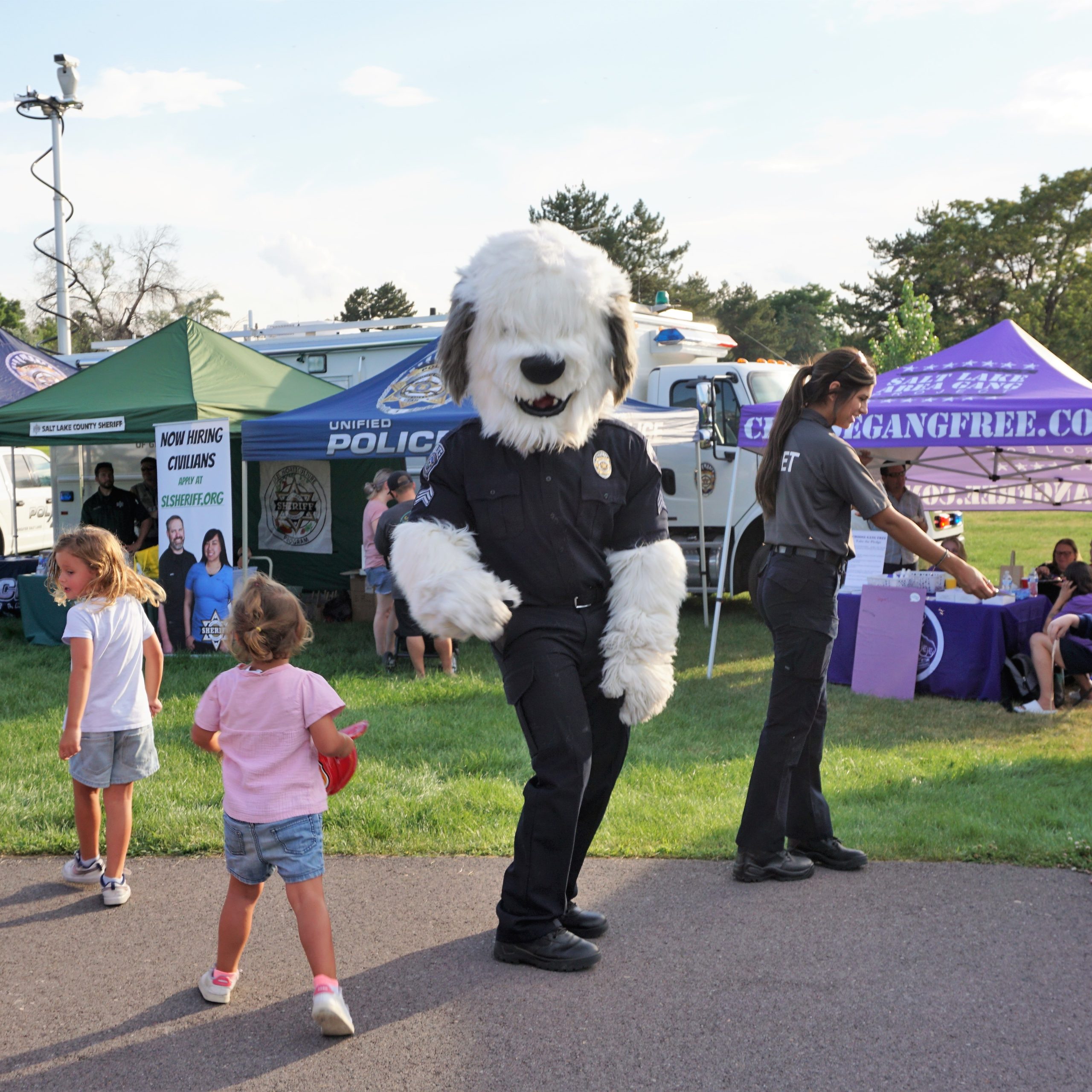 Millcreek Night Out Mascot Sgt Siren dancing with little girl